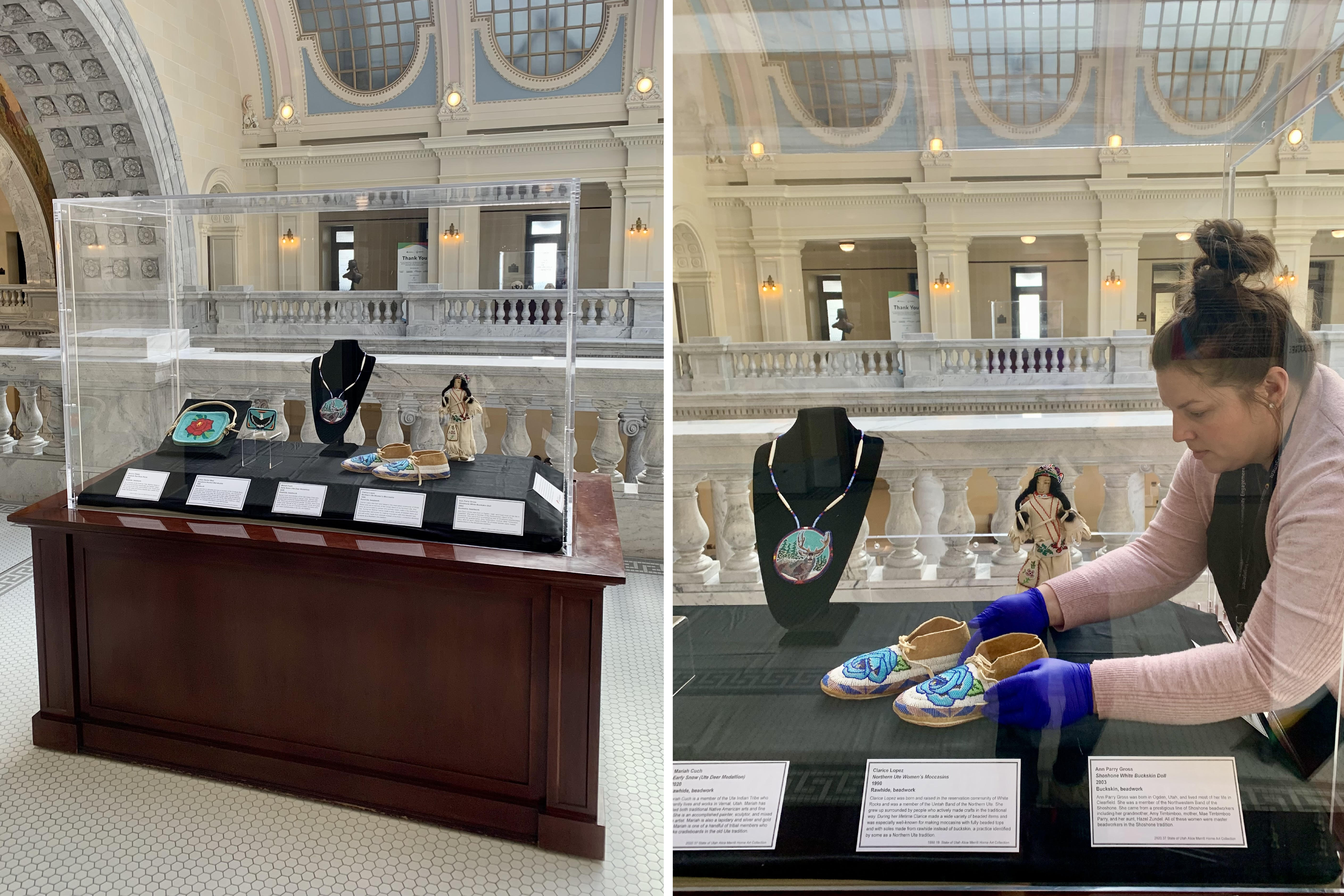 A display case with folk art and a woman with brown hair placing a piece in the case.