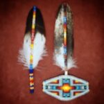 Two feathers decorated piece ofadorned with intricate Native American beadwork