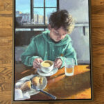 a painting of a young boy at a table with a cup of tea and a scone. Boy wears a green sweatshirt, the window behind him shows a blue sky day with buildings in distance