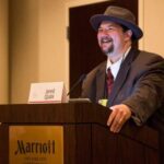 Author Jared Quan at a lectern
