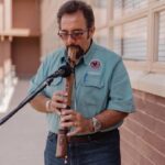 Teaching Artist Roger Clark playing a flute
