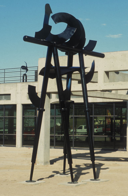 An abstract outdoor metal sculpture in black.